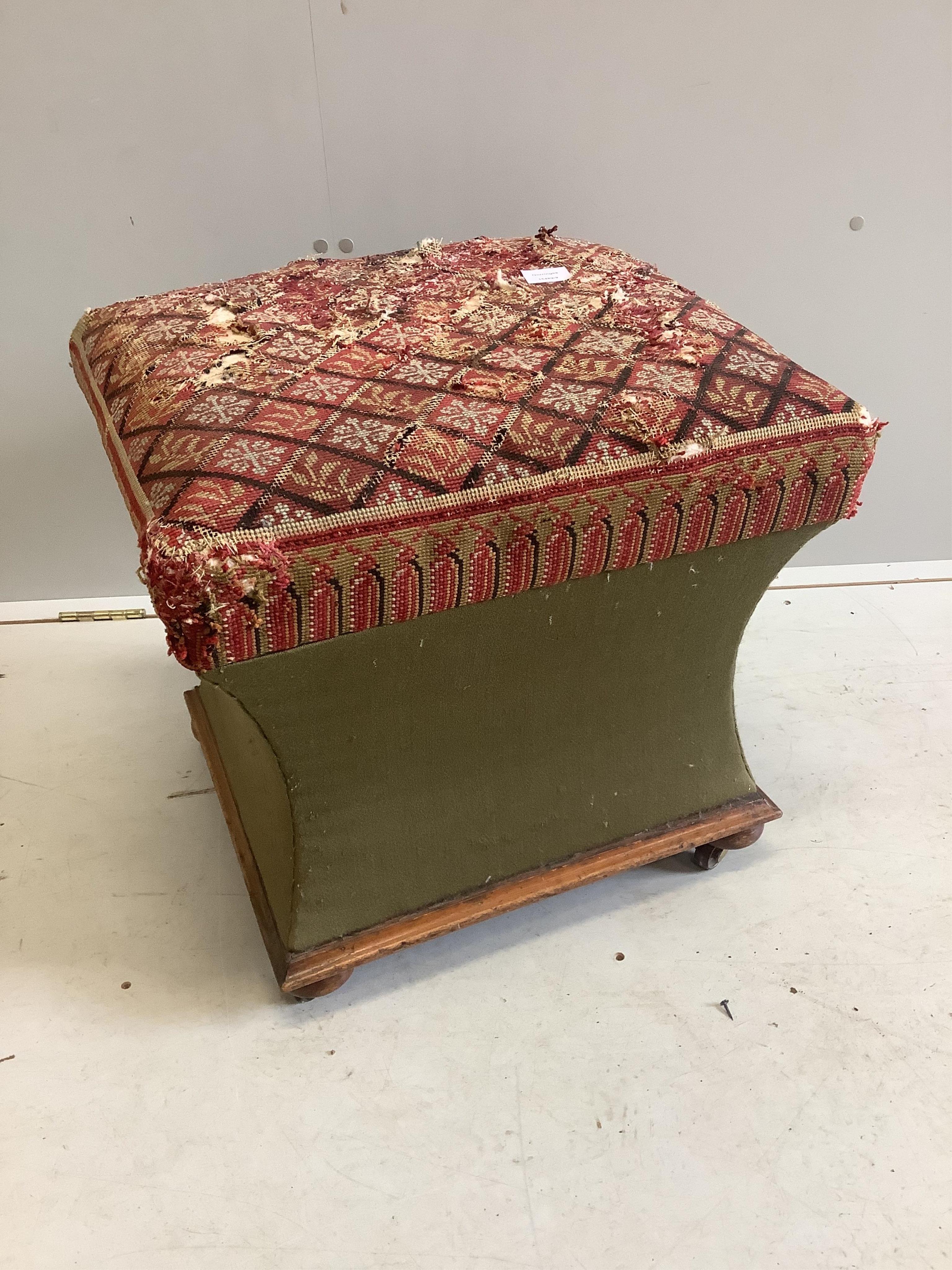 A Victorian upholstered ottoman stool, needle worked top, width 53cm, depth 48cm, height 48cm. Condition - poor